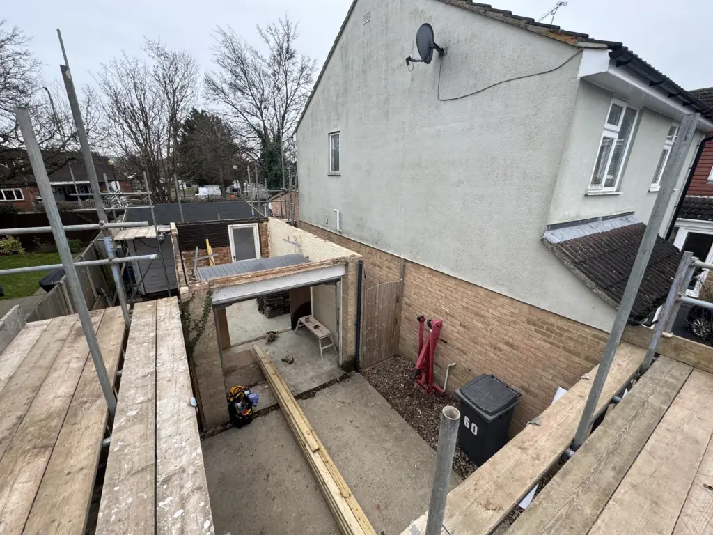 Groundworks beside the retained garage for a second-storey link extension in Chelmsford