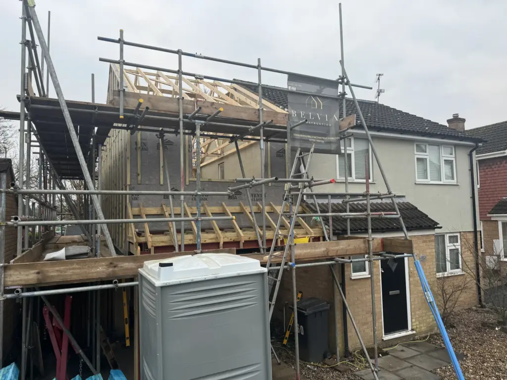 Scaffolded shell of a second-storey link extension at a home in Chelmsford