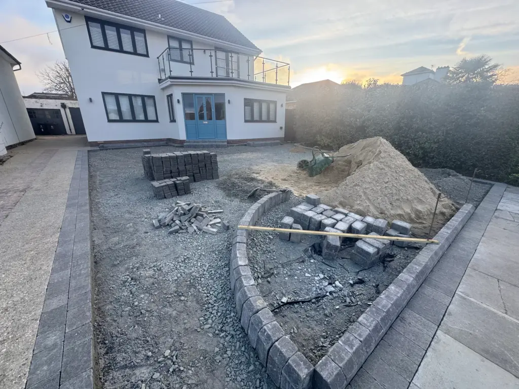 Compacted hardcore sub-base laid across a driveway in Frinton-on-Sea ahead of block paving
