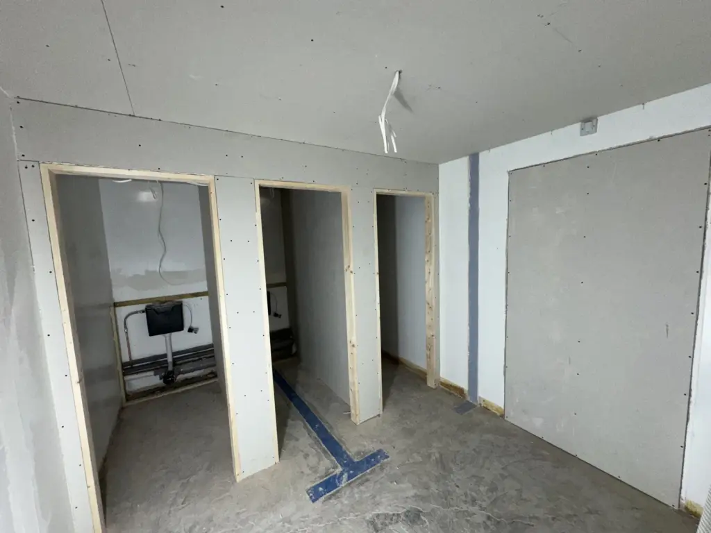 New washroom partitions boarded around concealed cisterns at The Hawthorns School in Chelmsford