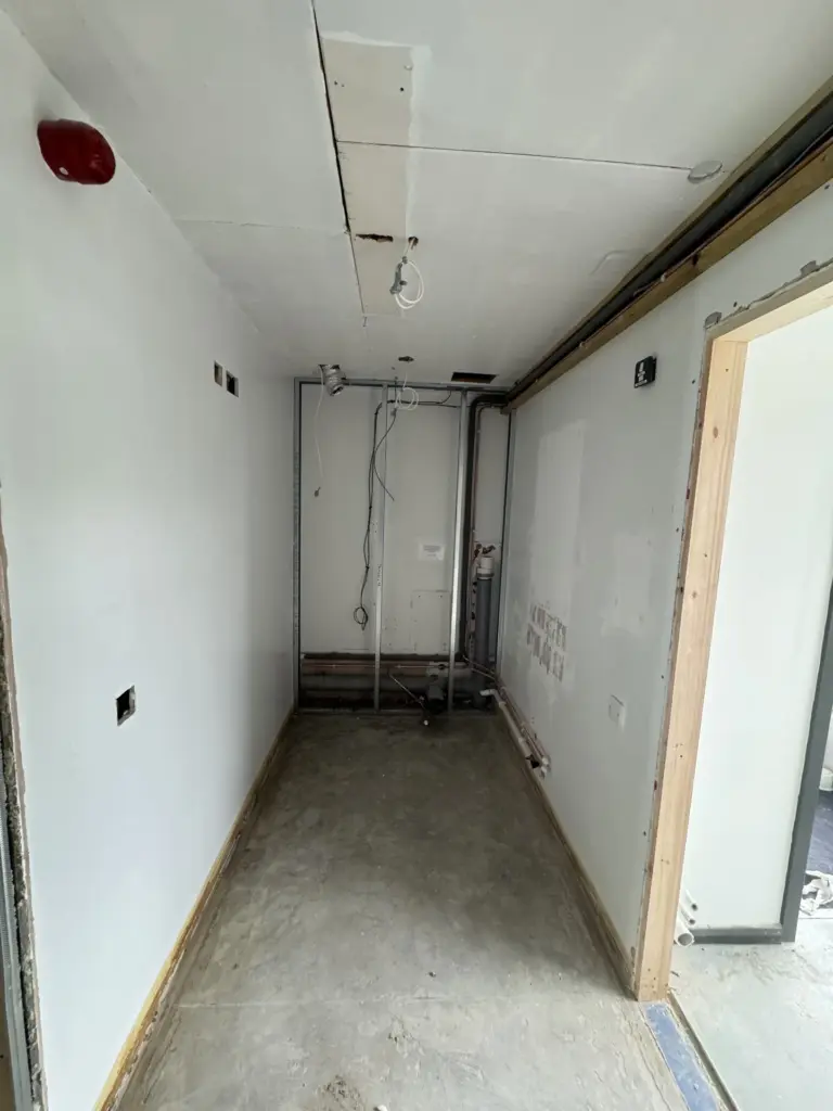 Partition framing and overhead cabling during The Hawthorns School washroom refurbishment in Chelmsford