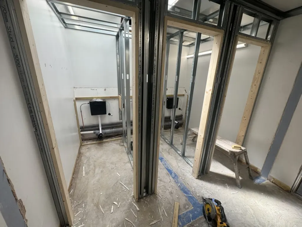 Cubicle partition framing with concealed cisterns during The Hawthorns School washroom refurbishment in Chelmsford