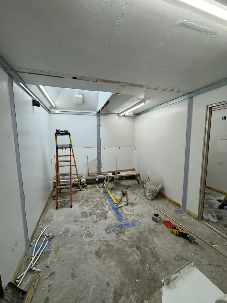 The Hawthorns School washroom nearing completion with painted walls and commercial vinyl flooring laid