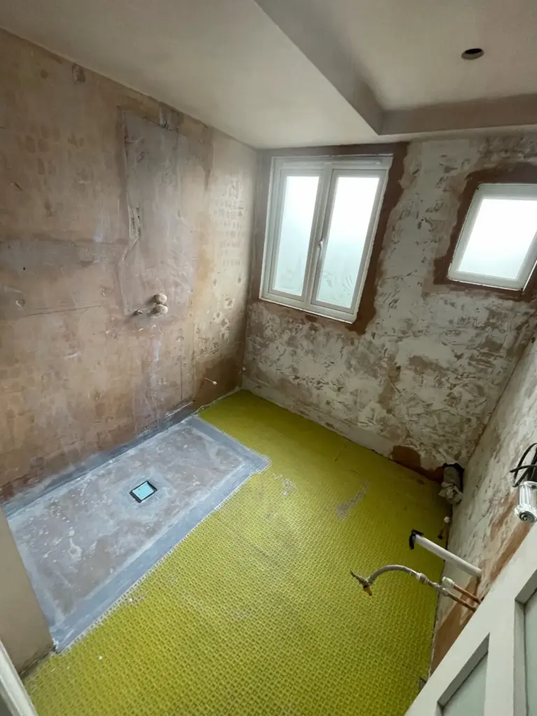 Bathroom stripped back to bare walls before renovation in Hutton