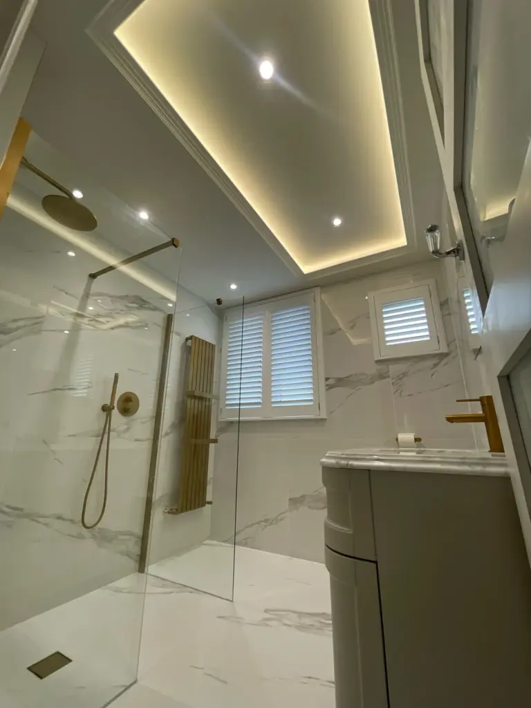Recessed ceiling with LED feature lighting in bathroom renovation Hutton