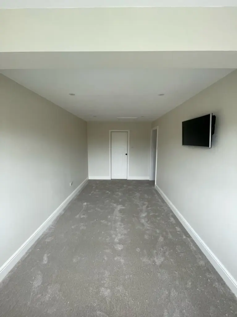 Completed bedroom created by a double storey side extension in Kelvedon, Essex