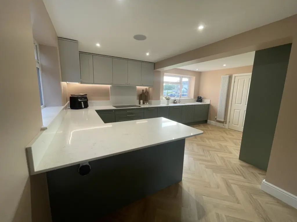 Kitchen island and green cabinetry in the completed Kelvedon double storey side extension