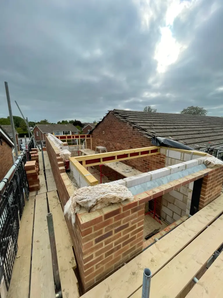 Foundation walls under construction for a double storey side extension in Kelvedon, Essex