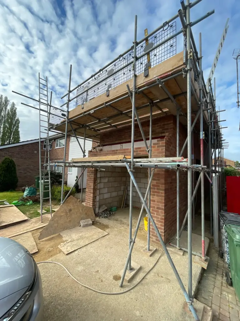 Scaffolded double storey side extension under construction in Kelvedon, Essex