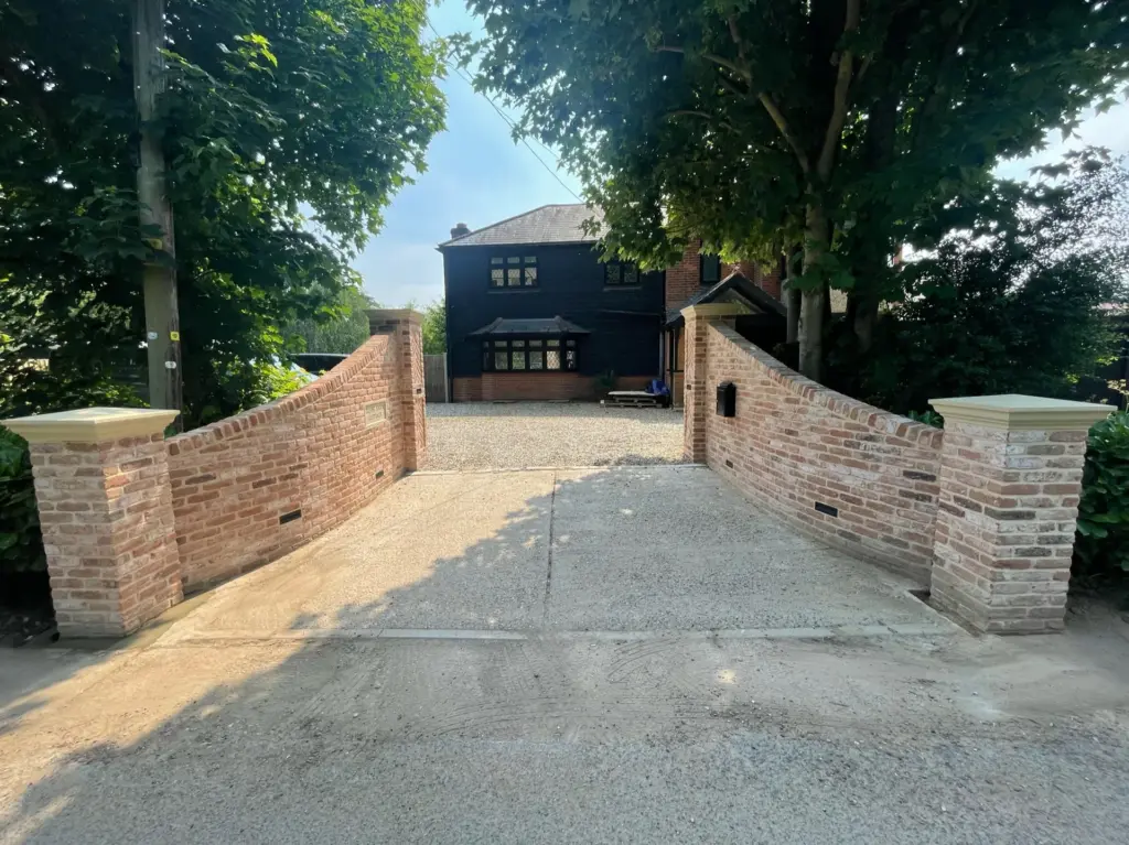Completed in-and-out brick driveway entrance and shingle parking area in Rivenhall