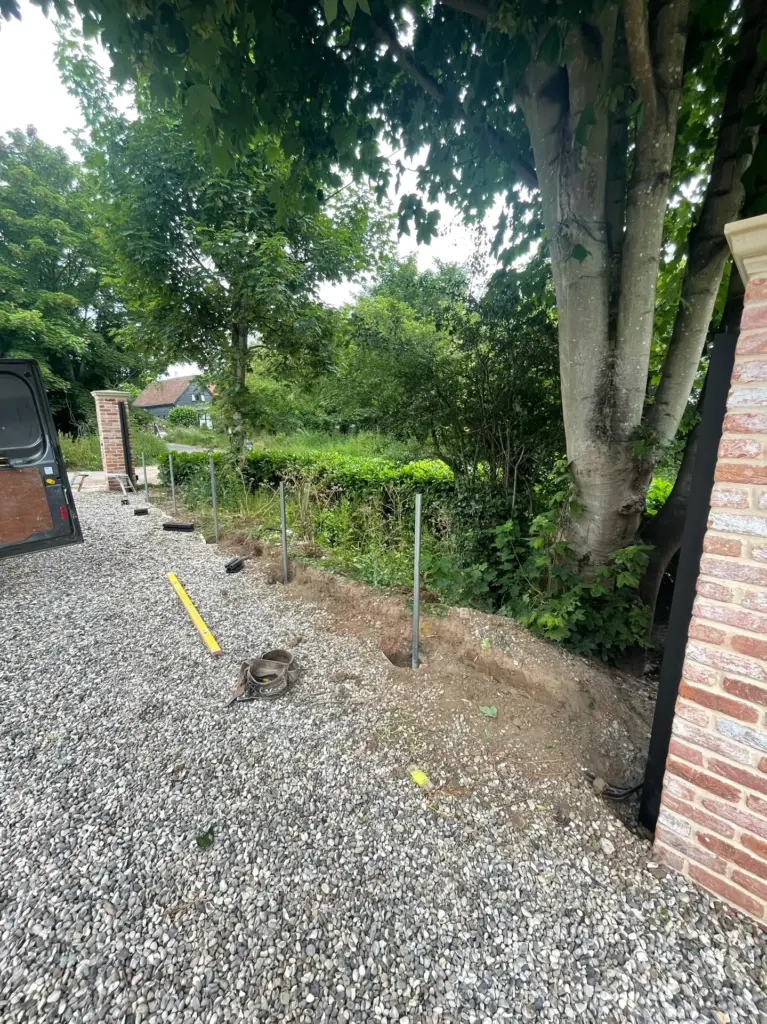 Shingle driveway surface and brick piers during the Rivenhall works