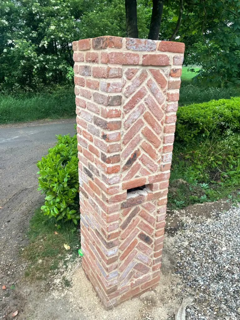Herringbone brick detail being formed on a driveway pier in Rivenhall