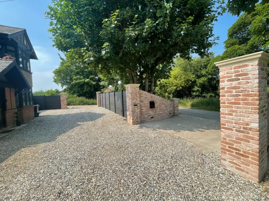 Completed shingle driveway approach with brick piers at the Rivenhall property