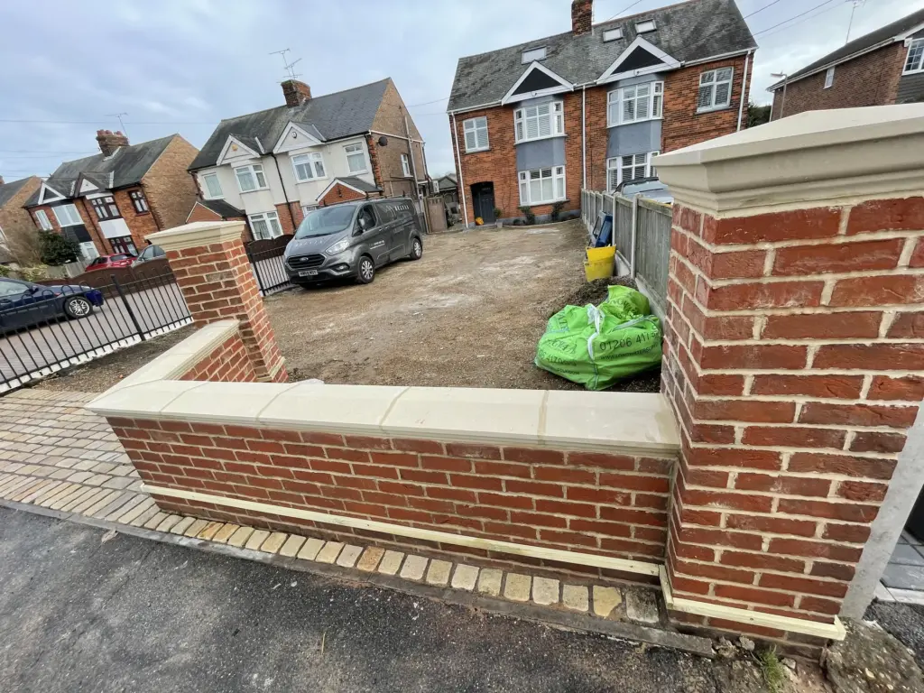 New brick entrance wall taking shape at the Witham property