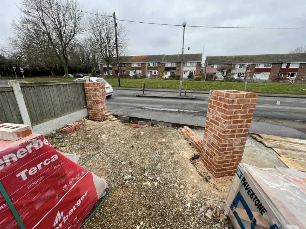 Brick entrance pillars under construction at the Witham driveway