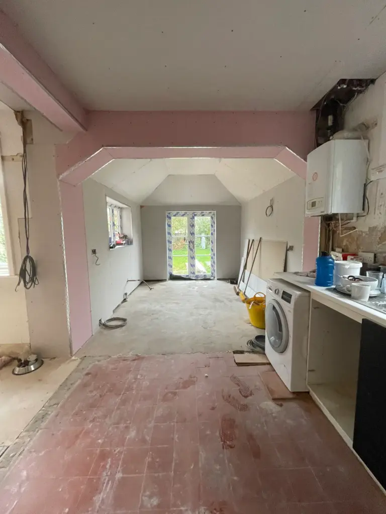 Insulation being fitted to the walls and floor of the converted outbuilding, part of this Witham ground floor project
