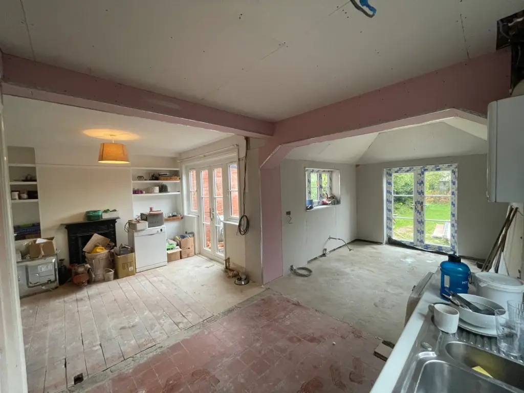 First-fix stage of the Witham refurbishment, with new rear French doors fitted and the floor stripped back