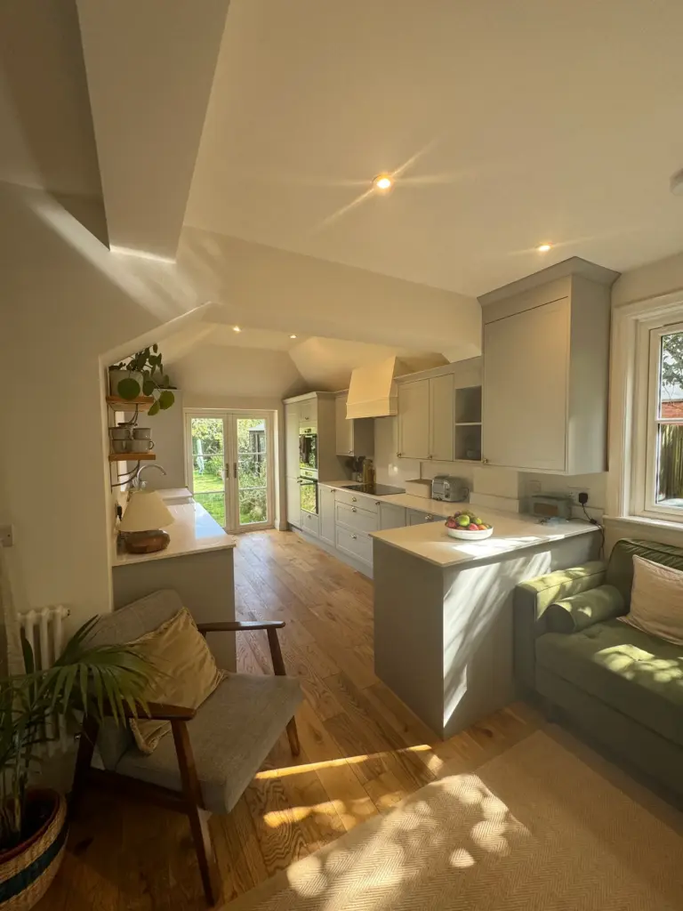 Alternate view of the finished kitchen, dining and living space in Witham, showing the full L-shaped layout