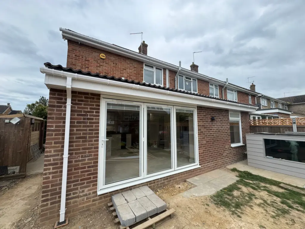 Completed single storey rear extension in Writtle with white aluminium bi-fold doors