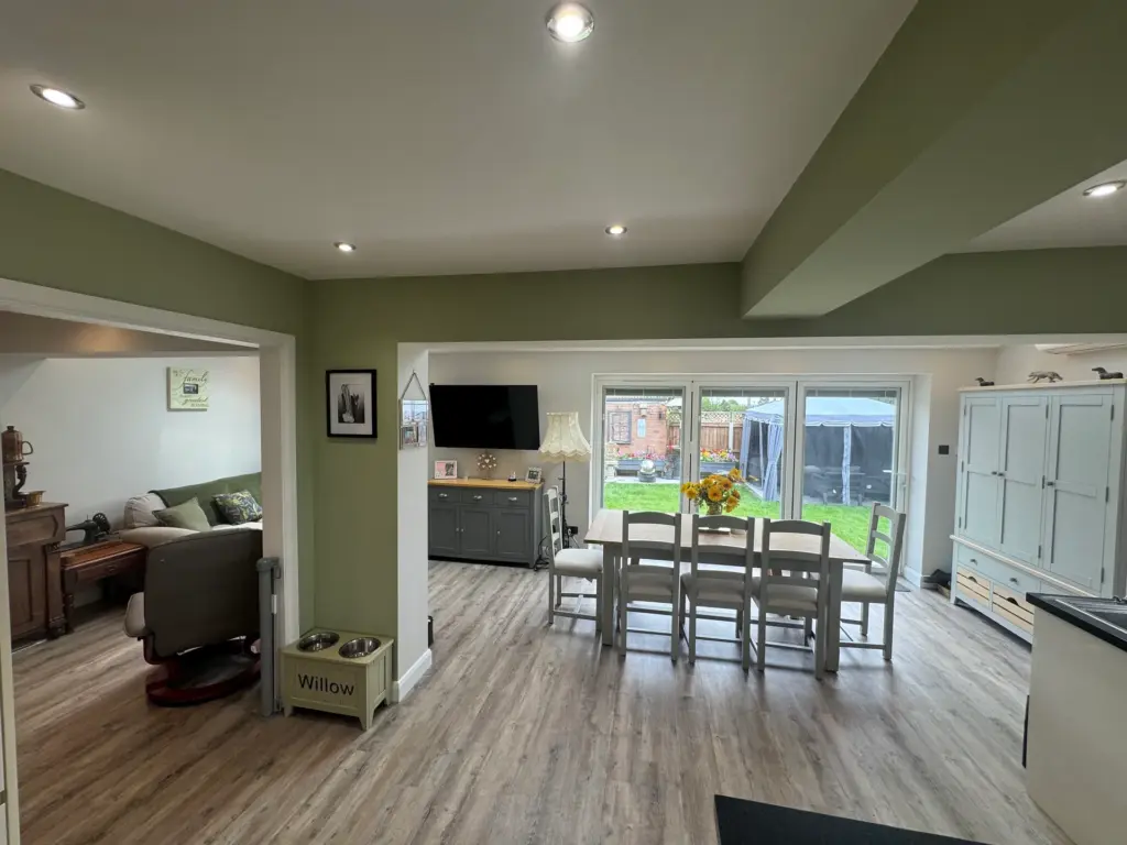 Furnished dining area in the Writtle extension looking through to the original living room